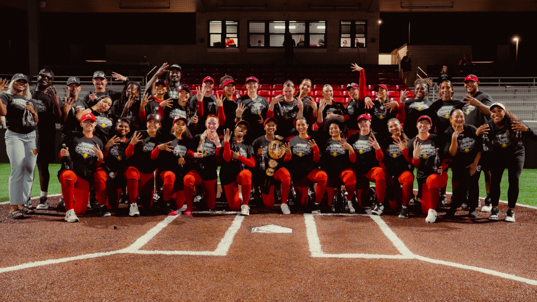 The 2026 PSL champions pose together at home plate with the championship belt